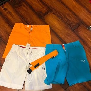 Puma golf short set of three shorts with puma belt. Size small for boys.